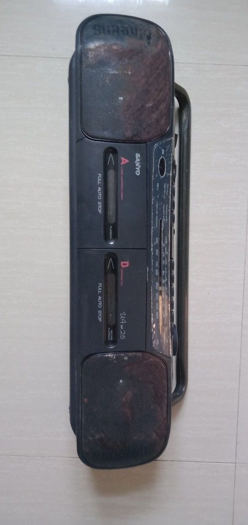 Sanyo Boombox (Category: Portable Music Players) located in Bulacan. Submitted by dyazpuzhpley021577r (Listing ID 1437440458, Image 1). Description: - Vintage Sanyo boombox - Dual cassette decks (A & B) - Built-in radio - Portable with a handle - Includes power cord - Built-in antenna - Features control knobs and buttons - Dark color scheme working unit fm tape issue need to use headphone or earphone para magamit di po lumabas sound sa main speak