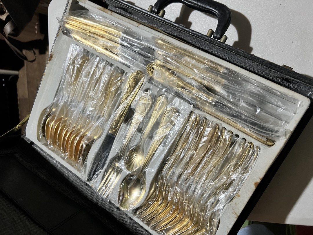 SBS Bestecke Solingen Gold Plated Flatware Set (Category: Dinnerware & Cutlery) located in Pasay City. Submitted by jdprotacio (Listing ID 1437564103, Image 2). Description: - SBS brand - Marked “23/24 Karat Hardwear Gold Electroplated” - Complete set with case - Vintage design with detailed engravings - Stored individually in plastic sleeves - Condition: Pre-loved, with minimal signs of storage/aging on the case.