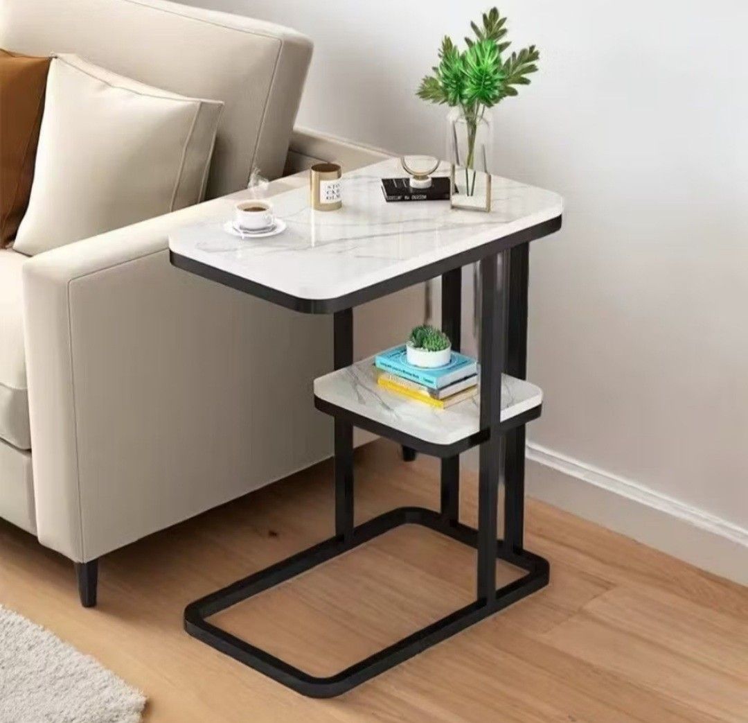 Side Table 2 Layer Sofa / Bedside (Marble White with Black Frame) (Category: Tables & Sets) located in Pateros City. Submitted by camillelego (Listing ID 1437575729, Image 1). Description: Side Table 2 Layer Sofa / Bedside (Marble White with Black Frame) Assembled, pickup as is Easy to Clean Made of thicken environmental protection board, imitating marble pattern Has a stable paint, steel frame, strong bearing capacity Safe rounded corners, round