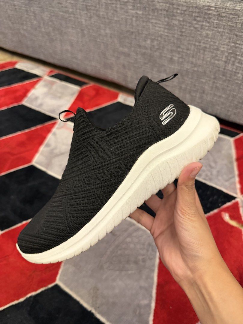 Skechers Slip-on Sneakers (Category: Sneakers) located in San Jose. Submitted by affordabletrendsby_cai (Listing ID 1437416598, Image 2). Description: - Black Skechers slip-on sneakers - White soles - Textured knit upper - Skechers logo on side and heel - Pull tab for easy wear - Lightly worn soles.