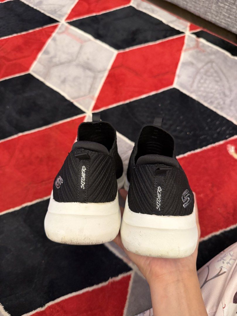 Skechers Slip-on Sneakers (Category: Sneakers) located in San Jose. Submitted by affordabletrendsby_cai (Listing ID 1437416598, Image 3). Description: - Black Skechers slip-on sneakers - White soles - Textured knit upper - Skechers logo on side and heel - Pull tab for easy wear - Lightly worn soles.