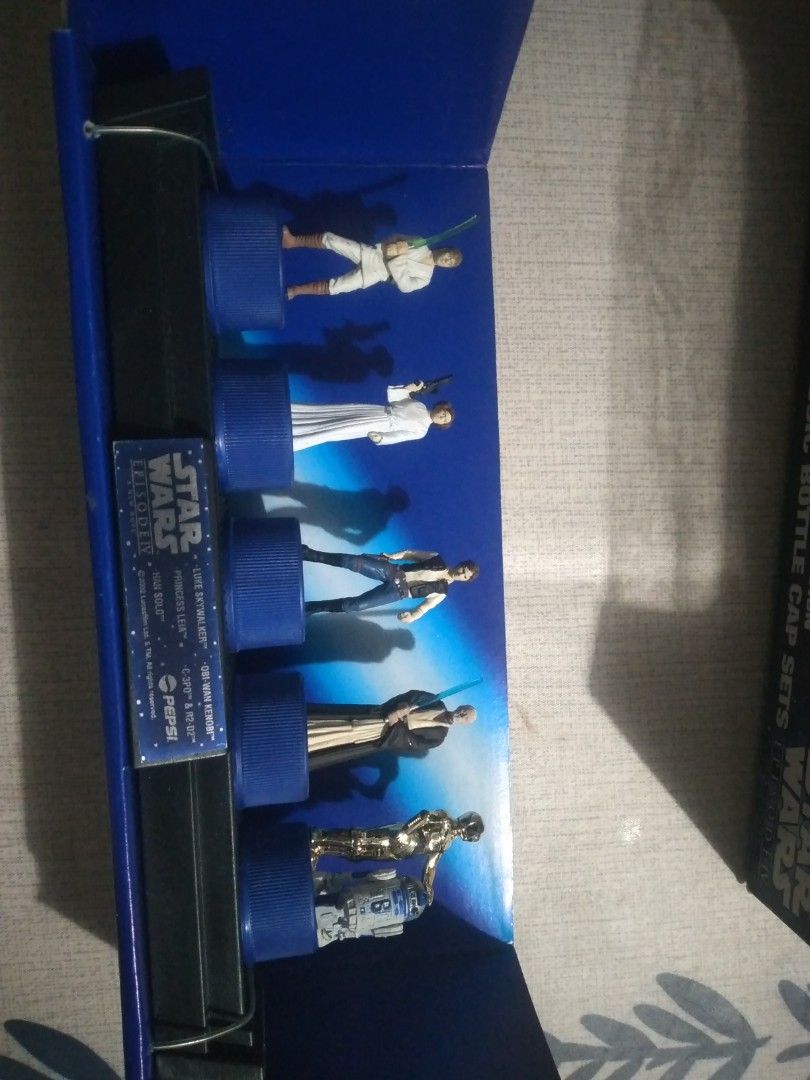 Star Wars Pepsi Bottle Cap Collectors item (Category: Vintage Collectibles) located in San Fernando. Submitted by kitkat.astina (Listing ID 1437531166, Image 3). Description: in pristine condition, Characters Included: The set features Luke Skywalker, Princess Leia, Han Solo, Obi-Wan Kenobi, and a combined C-3PO & R2-D2 figure. Origin: These were promotional items exclusively released with Pepsi bottles in Japan. Value: Complete sets or individua