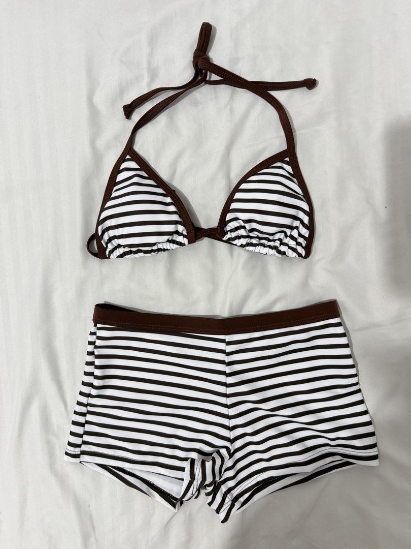 Striped Brown Tie Retro Y2K Bikini Short Set (Category: Bikinis & Swimsuits) located in Paranaque City. Submitted by ivyyyyyv (Listing ID 1437543974, Image 2). Description: - Brown and white striped bikini set - Halter top with triangle shape and brown trim - Boy short style bottoms with brown waistband - Smooth, swimwear-like fabric.