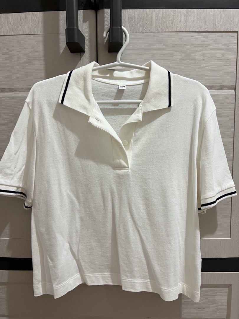 Uniqlo Polo Shirt (Category: Shirts) located in Bustos. Submitted by amcsantos_ (Listing ID 1437553198, Image 1). Description: - Size: Small - Collared neckline with black trim - Button-down placket - Cotton - White.