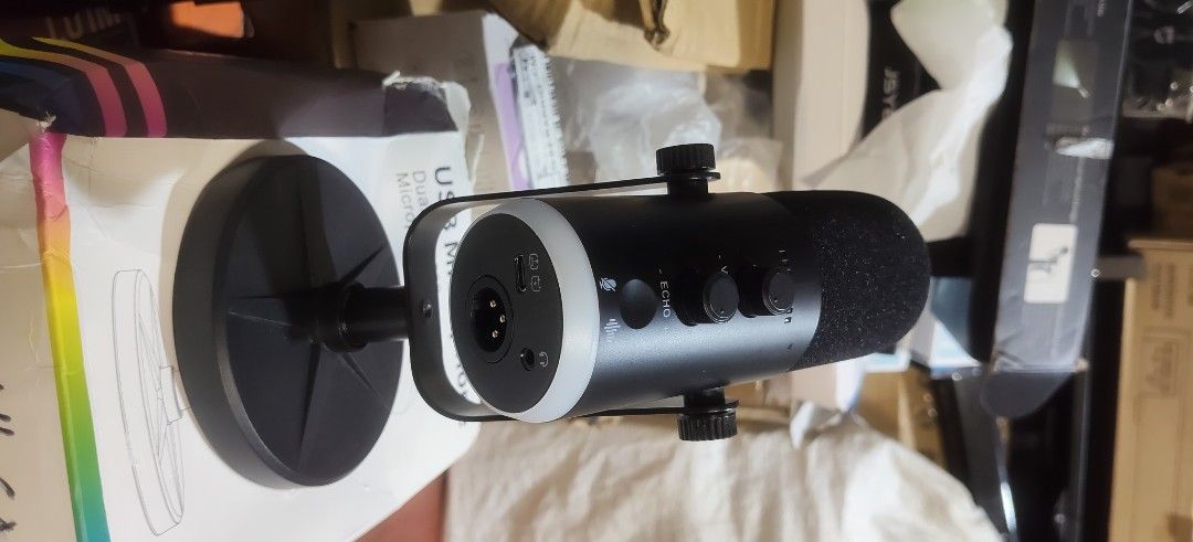 USB Microphone - Dual-purpose (Category: Microphones) located in Malabon City. Submitted by granmerlencagayandeoro (Listing ID 1437580902, Image 1). Description: - Dual-purpose USB microphone - Volume and echo controls - Includes a stand for easy placement - Sleek black design - USB port.