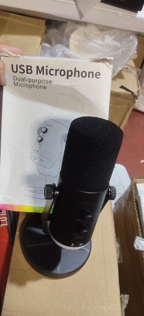 USB Microphone - Dual-purpose (Category: Microphones) located in Malabon City. Submitted by granmerlencagayandeoro (Listing ID 1437580902, Image 3). Description: - Dual-purpose USB microphone - Volume and echo controls - Includes a stand for easy placement - Sleek black design - USB port.