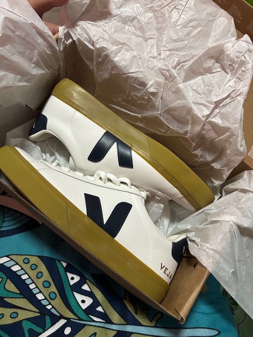 Veja Campo White Navy Sneakers (Category: Sneakers) located in Manila. Submitted by original-preloved-items (Listing ID 1437531454, Image 2). Description: - Veja Campo sneakers - Color: White with navy blue logo - Features a gum sole - White laces - Includes original box and packaging - Veja logo visible on the side.
