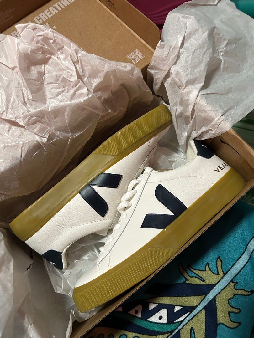Veja Campo White Navy Sneakers (Category: Sneakers) located in Manila. Submitted by original-preloved-items (Listing ID 1437531454, Image 1). Description: - Veja Campo sneakers - Color: White with navy blue logo - Features a gum sole - White laces - Includes original box and packaging - Veja logo visible on the side.