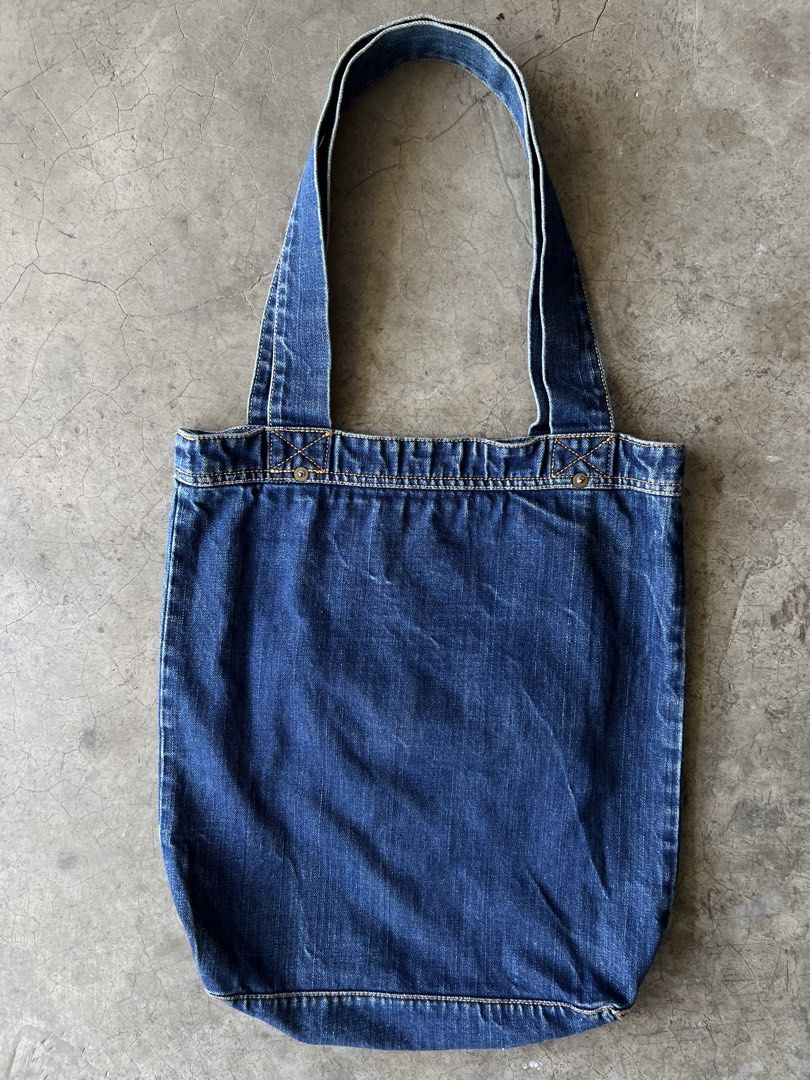 VISVIM - S/S18 SPOT DRY DENIM TOTE BAG (Category: Sling Bags) located in Cavite. Submitted by _Gizmo (Listing ID 1437484106, Image 3). Description: Visvim - S/S18 Spot Dry Denim Tote Bag Made from specially processed denim Dry shrink processed Custom blue selvedge outseam Measurement Width: 14.5’ Inch Length: 15.5’ Inch Depth: 3.5’ Inch Handle: 10’ Inch Used | Very good condition Material: 100% Cotton Made In Japan.
