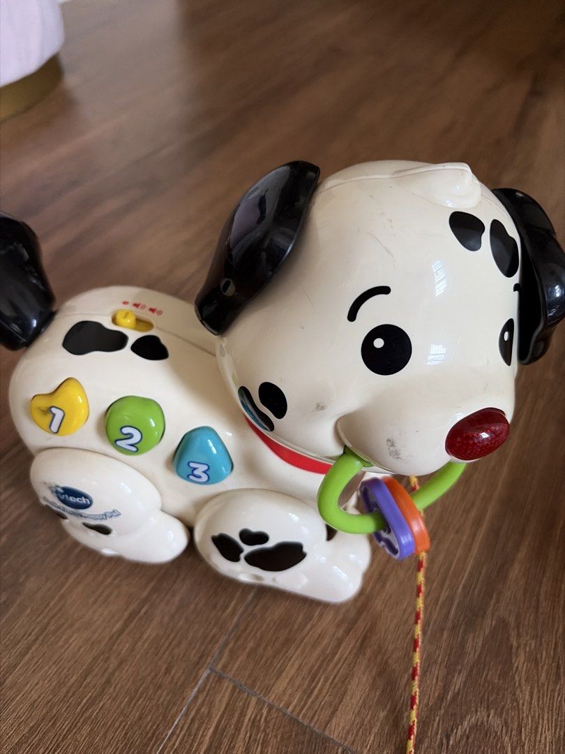 VTech Pull-Along Puppy Dog Toy (Category: Infant Playtime) located in Quezon City. Submitted by aabear_119 (Listing ID 1437441857, Image 2). Description: - VTech pull-along puppy dog toy - Features colorful buttons with numbers and letters - Easy to pull with a string - Dog shape with black spots and ears - Includes colorful rings around the neck - In good working condition 800 only for 2 items.