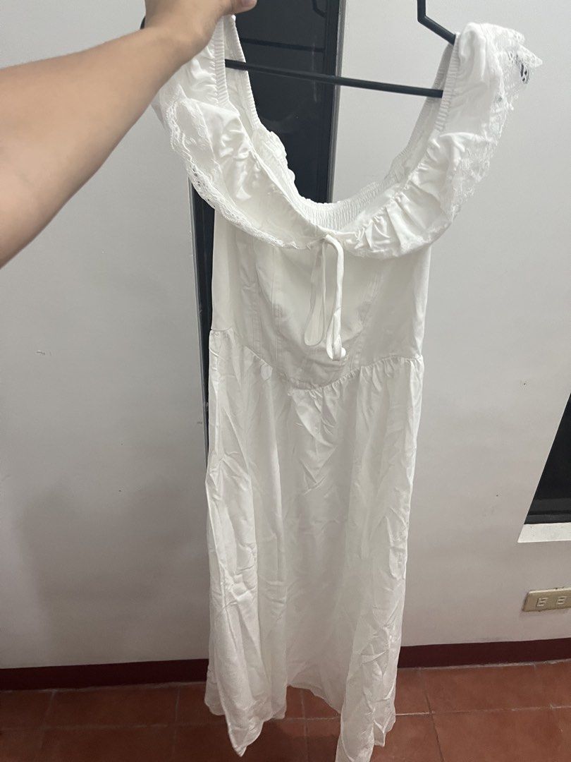 White Off-Shoulder Midi Dress (Category: Dresses) located in Manila. Submitted by reiiberry (Listing ID 1437506277, Image 2). Description: - White off-shoulder midi dress - Delicate lace detailing - Smocked bodice - Tie detail at bust - Flowy midi skirt - Ideal for summer or special occasions.