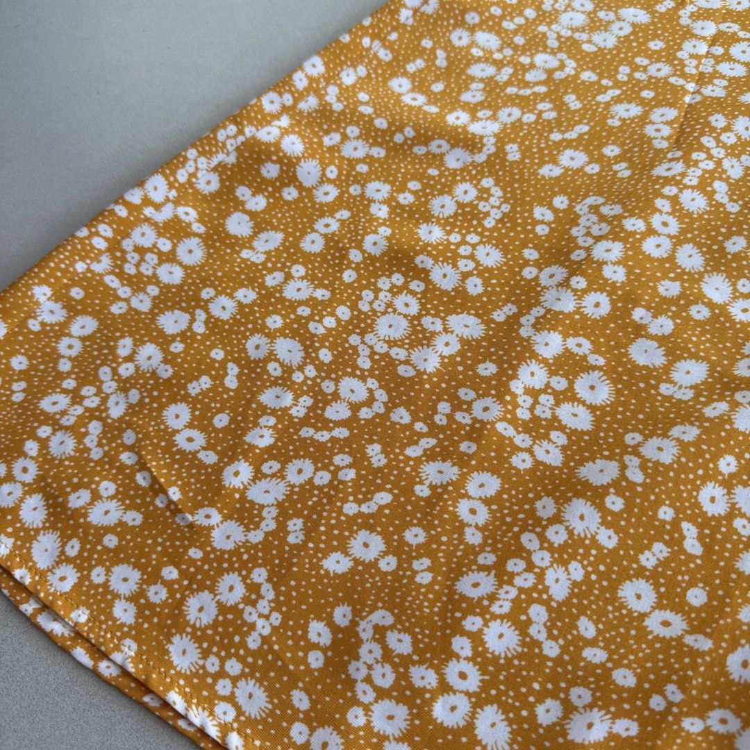 Yellow Floral Slit Skirt (Category: Skirts) located in Cebu City. Submitted by strawbeanz (Listing ID 1437465297, Image 3). Description: - Mustard yellow midi skirt - White floral print - High front slit - Fitted waist - Midi length - Lightweight fabric - Ideal for casual or summer wear.