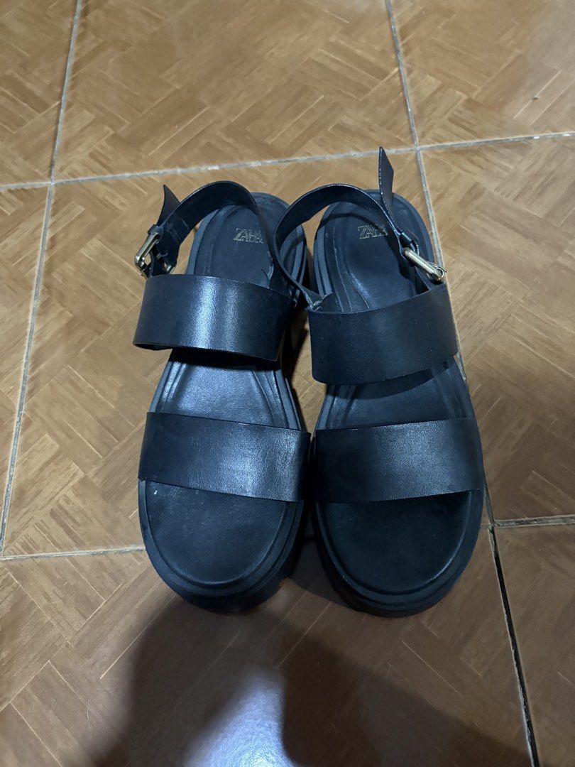 Zara Black Platform Sandals (Category: Flats & Sandals) located in Quezon City. Submitted by brandedthingsforless (Listing ID 1437517012, Image 1). Description: - Zara black platform sandals - Size: 37 EUR - Features: Buckle closure, thick sole - Color: Black - Made in India - Condition: Some wear on soles and leather .