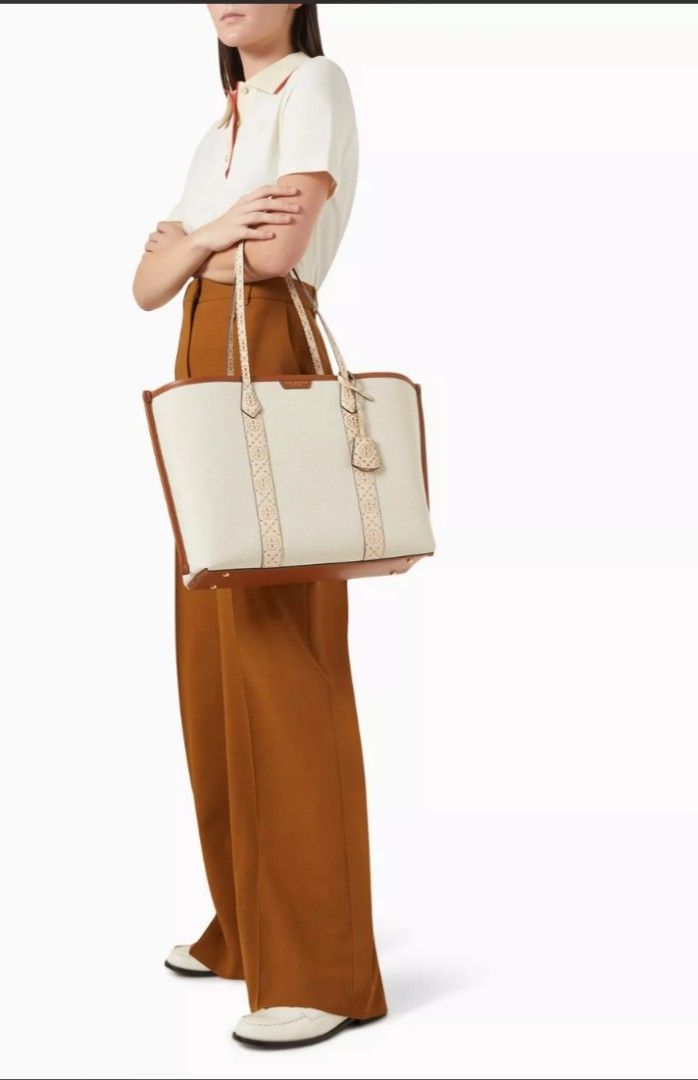 💯 Tory Burch Perry Canvas Triple-Compartment Tote (Category: Luxury Bags & Wallets) located in Mandaluyong City. Submitted by arlene2560 (Listing ID 1437716454, Image 1). Description: 💯 Authentic Tory Burch Perry Canvas Triple Compartment Tote bag in a natural cream color with brown leather trim. New, with dustbag. Retails at 32k in Rustan's. Decluttering low at 21k. Mandaluyong - Tory Burch tote bag - Canvas body with leather trim - Triple-com