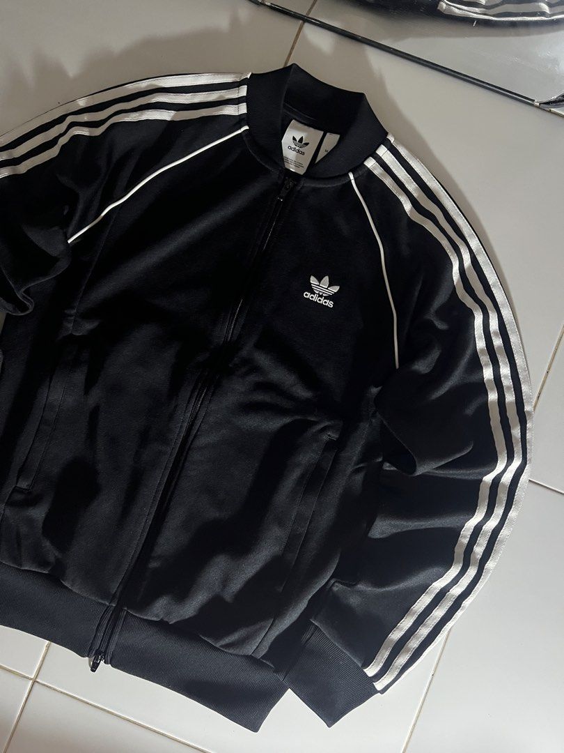 Adidas Adicolor Classics SST track jacket black (Category: Coats, Jackets and Outerwear) located in Manila. Submitted by metromnlwear (Listing ID 1437755862, Image 3). Description: W:20” L:26” [Medium on tag fit to large No Issue Color Rate: 10/10 Condition: EXCELLENT to AS NEW.