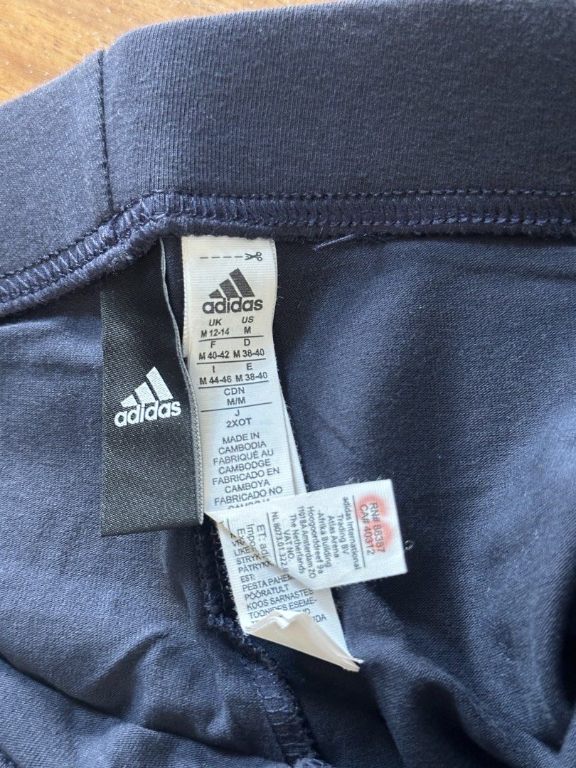Adidas Leggings - Size M (Category: Activewear) located in Quezon City. Submitted by cam.declutters (Listing ID 1437668707, Image 3). Description: - Adidas navy blue leggings - Size: M - Features Adidas logo on the side - Made in Cambodia.