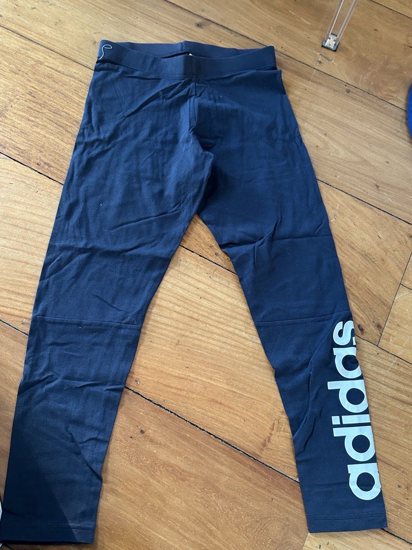 Adidas Leggings - Size M (Category: Activewear) located in Quezon City. Submitted by cam.declutters (Listing ID 1437668707, Image 1). Description: - Adidas navy blue leggings - Size: M - Features Adidas logo on the side - Made in Cambodia.