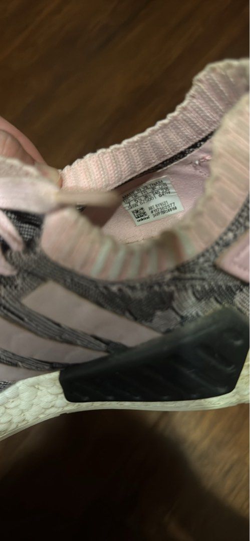Adidas NMD R1 Boost Sneakers (Category: Sneakers) located in Quezon City. Submitted by wilstockpile (Listing ID 1437698991, Image 3). Description: - Adidas NMD R1 Boost sneakers - Pink and grey colorway - Iconic Boost sole for superior comfort - Pink laces - Adidas stripes detail - Size tag visible in photos - Minor wear on soles.