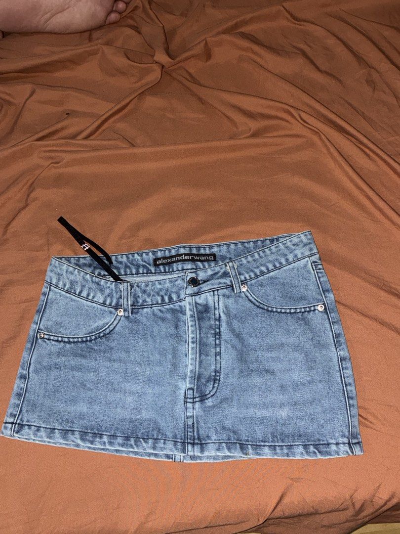 Alexander Wang Assymetrical Denim Mini Skirt (Category: Skirts) located in Quezon City. Submitted by _stphnlswardrobe (Listing ID 1437695637, Image 1). Description: Brand: Alexander Wang Size: 27 on tag; 30” measured with a measuring tape Condition: Like New Note: Open to Negotiations but no lowballing!! MOD: Lalamove, GGX ONLY MOP: GCash, Maya ONLY.