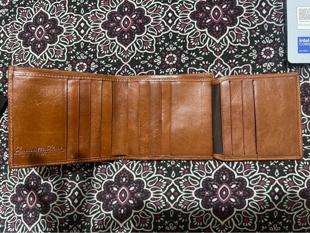 Australian Genuine Leather Wallet (Category: Wallets & Card holders) located in Quezon City. Submitted by minekoh21 (Listing ID 1437685436, Image 3). Description: - Genuine leather Bi-fold wallet - Interior: Brown - Exterior: Decorative emblem - Multiple card slots - Clear ID window - With Zippered compartment for coins - Like New, no issue RFS: Lots of wallets.