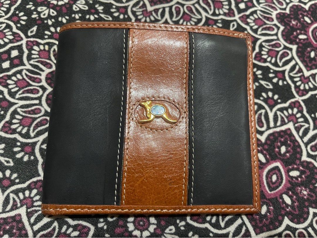 Australian Genuine Leather Wallet (Category: Wallets & Card holders) located in Quezon City. Submitted by minekoh21 (Listing ID 1437685436, Image 1). Description: - Genuine leather Bi-fold wallet - Interior: Brown - Exterior: Decorative emblem - Multiple card slots - Clear ID window - With Zippered compartment for coins - Like New, no issue RFS: Lots of wallets.