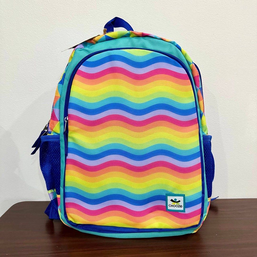 [Authentic] Chooze Reversible Kids Backpack Rainbow Waves & Heart Drops Print Small (Category: Backpacks) located in Quezon City. Submitted by brandedusagoodies (Listing ID 1437639045, Image 1). Description: Bright and playful Chooze reversible kids backpack featuring colorful rainbow wave stripes on one side and rainbow heart drop prints on the other for two fun looks in one bag. Made with durable water-resistant material and padded straps for c