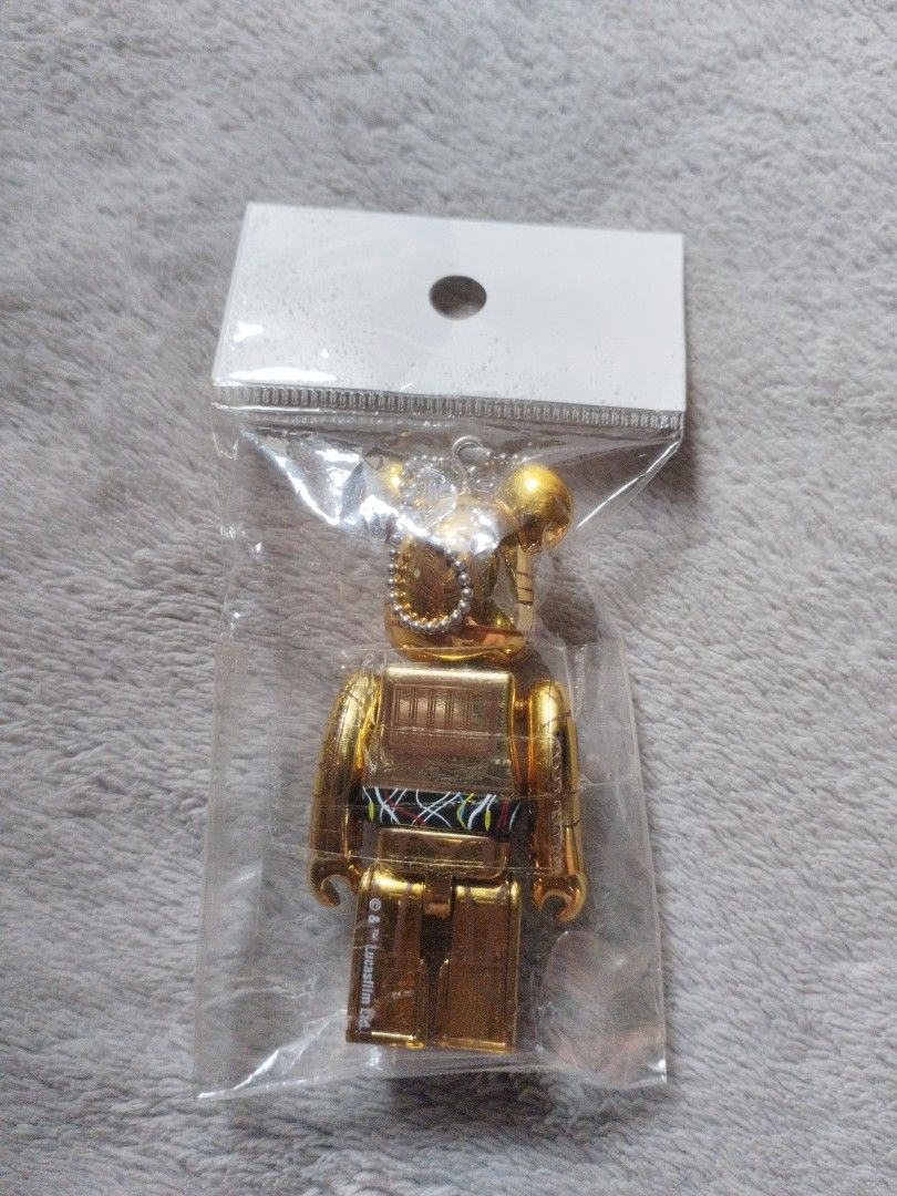 Bearbrick C-3PO Keychain (Category: Character Goods) located in Davao. Submitted by mengsmixitems (Listing ID 1437640251, Image 3). Description: - Gold C-3PO Bearbrick keychain - Includes chain for easy attachment - Features detailed C-3PO design - Still in original packaging - Great for Star Wars collectors.