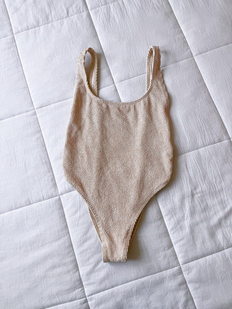 Billabong Textured One-Piece Swimsuit (Category: Bikinis & Swimsuits) located in Muntinlupa City. Submitted by jasmin.shop (Listing ID 1437698764, Image 3). Description: - Billabong one-piece swimsuit - Textured fabric - Scoop back design - High-cut leg - Stylish ring details on sides - Neutral color - Moderate back coverage - Classic silhouette - Thin straps - Rounded neckline - brand new no tag.