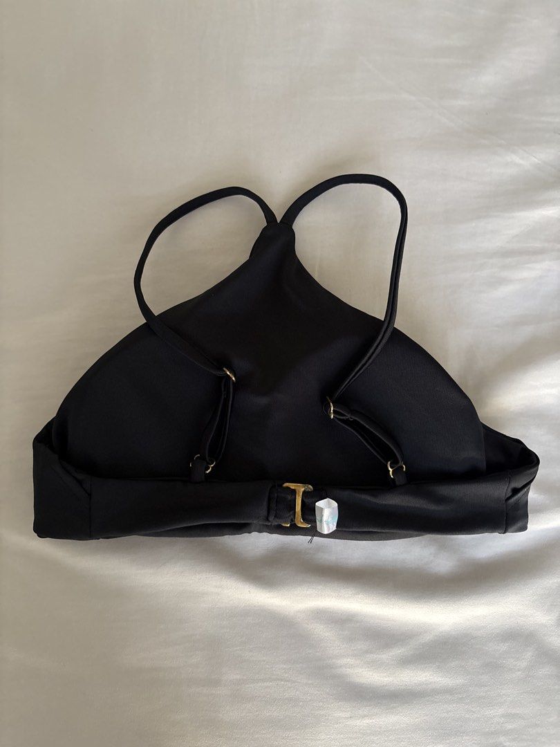 Black Bikini Top (Category: Bikinis & Swimsuits) located in Angeles City. Submitted by classictop (Listing ID 1437733807, Image 2). Description: - Black halter bikini top - Adjustable straps - Clasp closure at the back - Smooth, solid fabric - Simple, classic design - Suitable for various body types - Perfect for beach or pool.