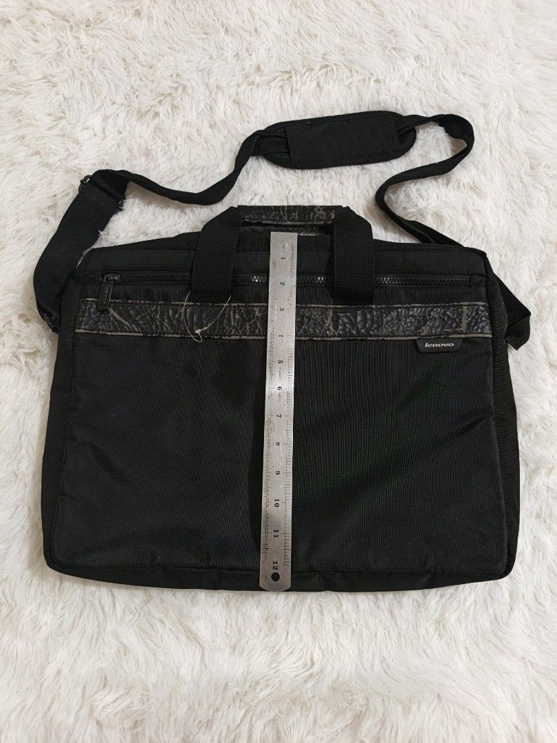 Black Laptop Bag with Shoulder Strap (Category: Laptop Bags & Sleeves) located in Marikina City. Submitted by andreah_16 (Listing ID 1437600694, Image 3). Description: nasa last photo yung issue - Black laptop bag - Includes shoulder strap and top handles - Front zipper pocket - Multiple interior compartments - Padded shoulder strap - Durable, water-resistant material.