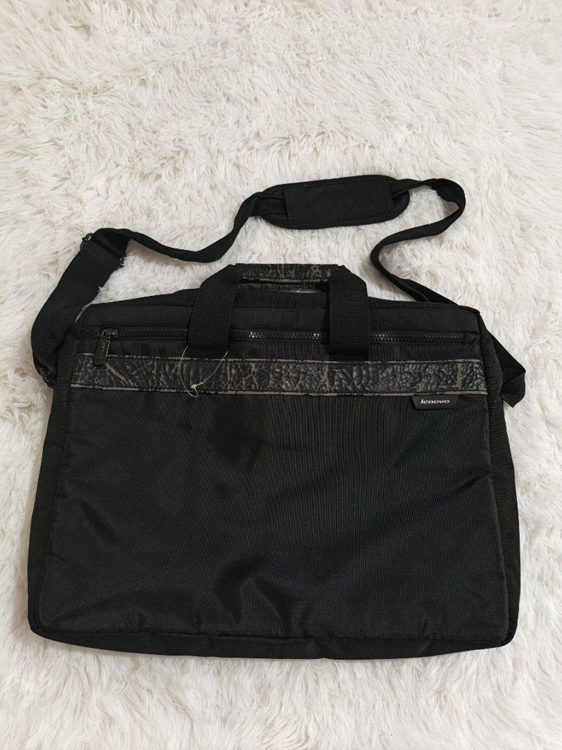 Black Laptop Bag with Shoulder Strap (Category: Laptop Bags & Sleeves) located in Marikina City. Submitted by andreah_16 (Listing ID 1437600694, Image 1). Description: nasa last photo yung issue - Black laptop bag - Includes shoulder strap and top handles - Front zipper pocket - Multiple interior compartments - Padded shoulder strap - Durable, water-resistant material.