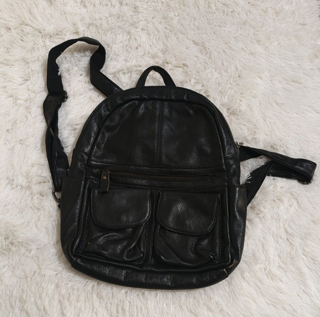 Black Leather Backpack (Category: Backpacks) located in Marikina City. Submitted by andreah_16 (Listing ID 1437597071, Image 1). Description: - Black leather backpack - Two front pockets - Top handle - Adjustable shoulder straps - Zippered main compartment - Textured leather - Simple, classic design - Ideal for everyday use.
