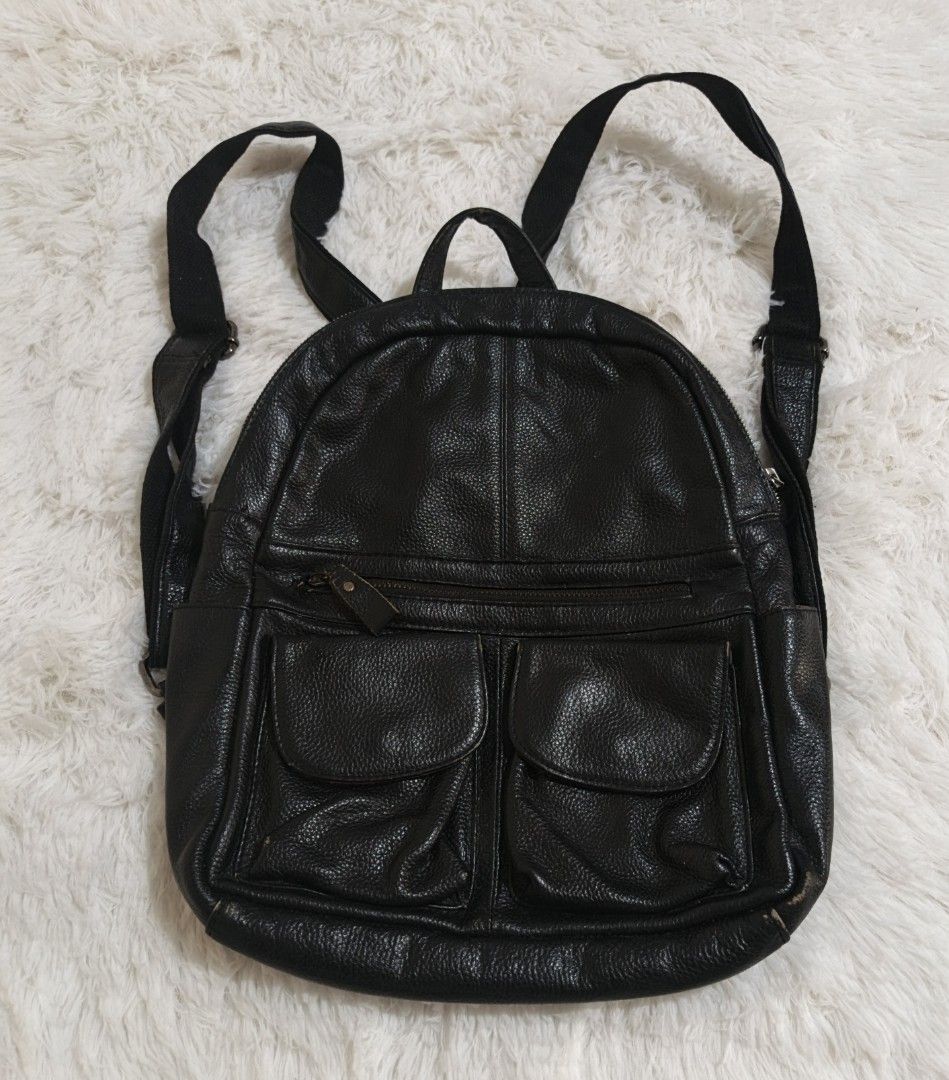 Black Leather Backpack (Category: Backpacks) located in Marikina City. Submitted by andreah_16 (Listing ID 1437597071, Image 3). Description: - Black leather backpack - Two front pockets - Top handle - Adjustable shoulder straps - Zippered main compartment - Textured leather - Simple, classic design - Ideal for everyday use.