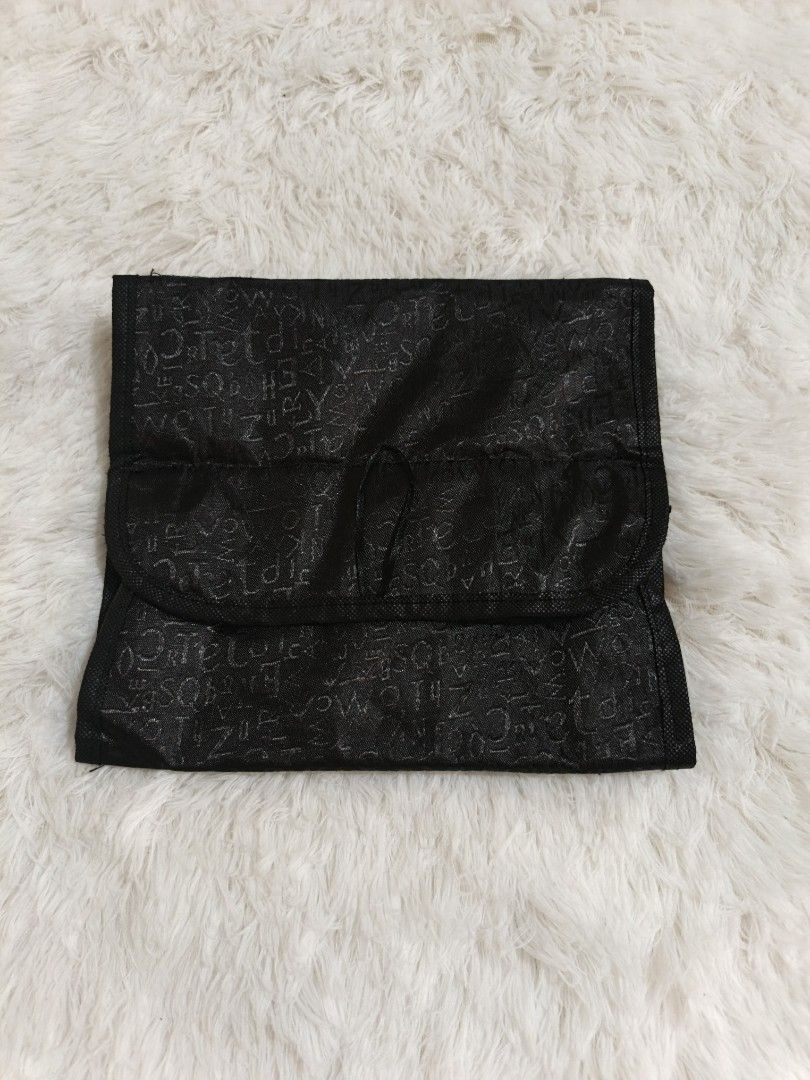 Black Roll-Up Cosmetic Organizer (Category: Makeup) located in Marikina City. Submitted by andreah_16 (Listing ID 1437598219, Image 3). Description: free for buyers manage ur expectation free po ito. - Black cosmetic organizer - Multiple clear, zippered compartments - Perfect for makeup and toiletries - Rolls up for compact storage - Snap closures for security - Subtle exterior pattern.