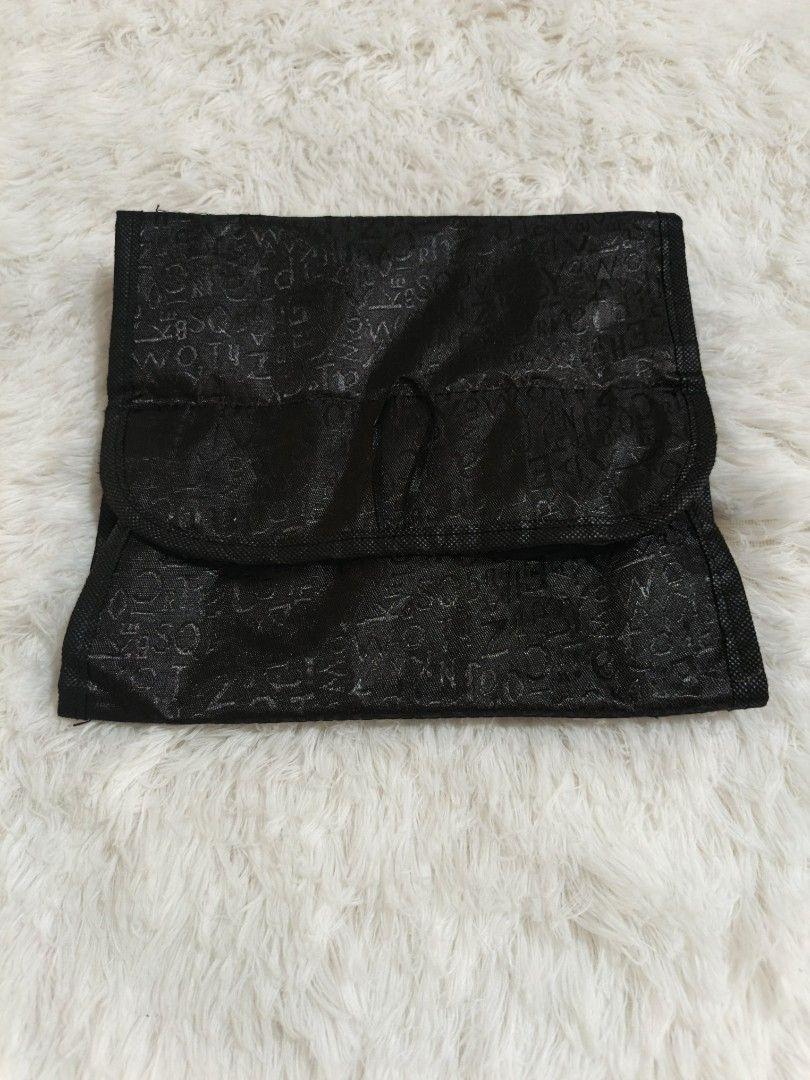 Black Roll-Up Cosmetic Organizer (Category: Makeup) located in Marikina City. Submitted by andreah_16 (Listing ID 1437598219, Image 2). Description: free for buyers manage ur expectation free po ito. - Black cosmetic organizer - Multiple clear, zippered compartments - Perfect for makeup and toiletries - Rolls up for compact storage - Snap closures for security - Subtle exterior pattern.