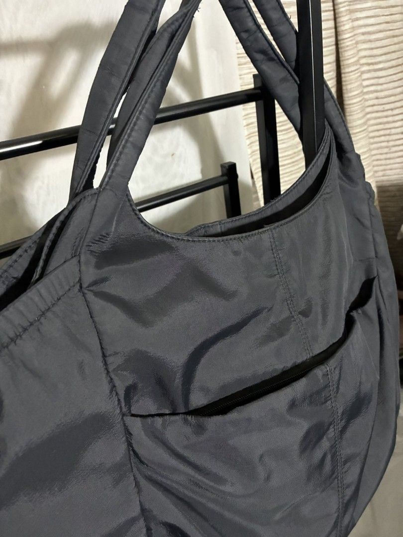 Black Shoulder Bag with Zipper Pockets (Category: Shoulder Bags) located in Quezon City. Submitted by never_a_clutter (Listing ID 1437682631, Image 3). Description: - Black shoulder bag - Multiple pockets for storage - Secure zipper closure - Comfortable dual handles - Durable nylon-like material - Stylish curved shape - Side pocket - without sling - hobo type.