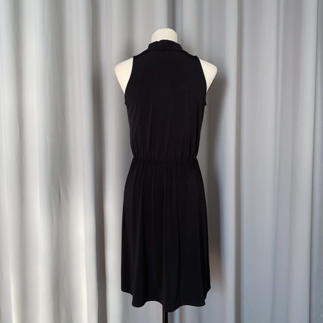 black sleeveless bow dress (Category: Dresses) located in Muntinlupa City. Submitted by declutterwithkk (Listing ID 1437721139, Image 2). Description: - black sleeveless dress - bow detail, fitted waist, flowing skirt.