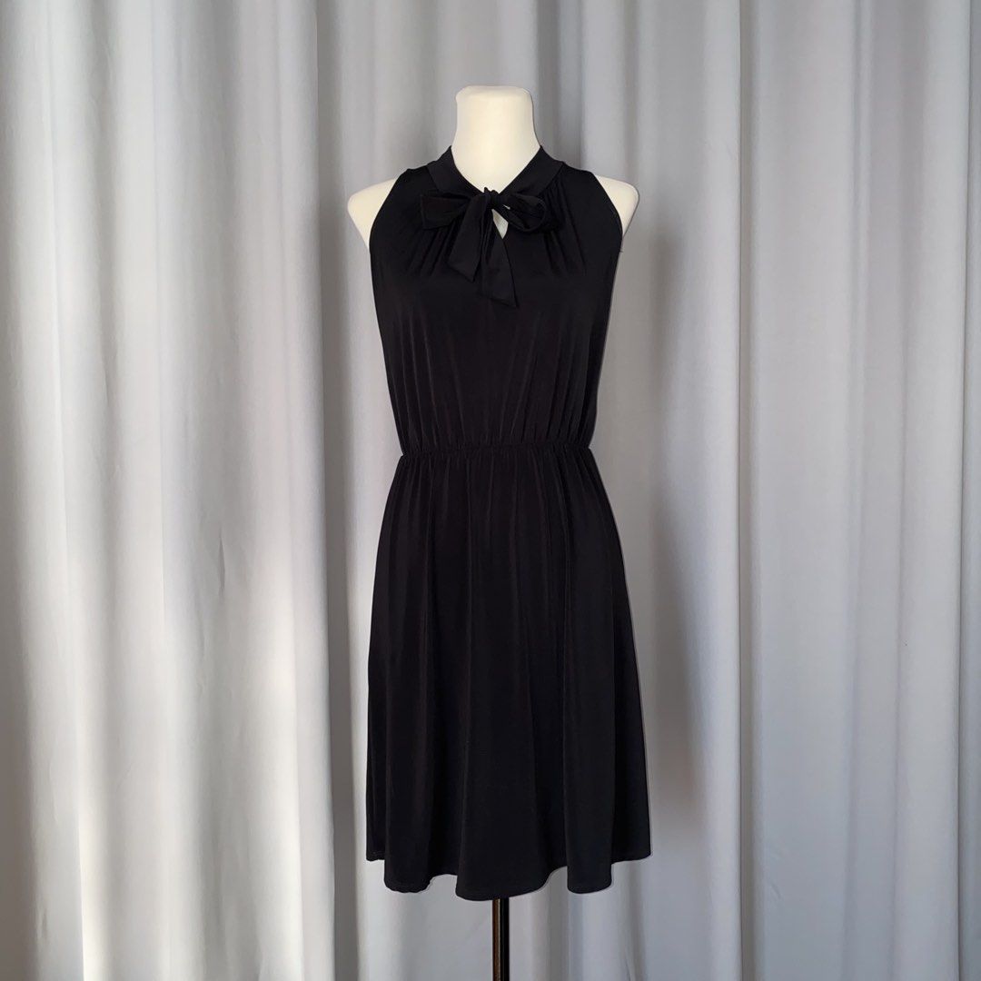 black sleeveless bow dress (Category: Dresses) located in Muntinlupa City. Submitted by declutterwithkk (Listing ID 1437721139, Image 1). Description: - black sleeveless dress - bow detail, fitted waist, flowing skirt.