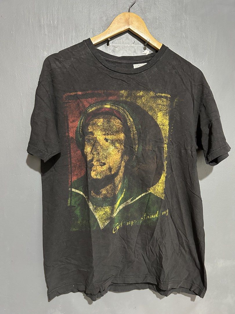 Bob Marley Get Up Stand Up Shirt (Category: Tshirts & Polo Shirts ) located in Tarlac. Submitted by nothingbutlesthrift (Listing ID 1437671290, Image 1). Description: Issues: Faded prints, faded shirt, cracks, pinhole No tag ₱150.