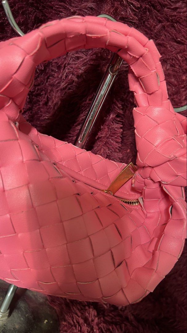 Bottega Veneta Jodie Mini Bag (Category: Luxury Bags & Wallets) located in Muntinlupa City. Submitted by armendaber03743 (Listing ID 1437734693, Image 2). Description: - Bottega Veneta Jodie Mini Bag - Color: Pink - Design: Woven - Features: Top handle, zip closure - Interior: Serial number B00169610A - Hardware: Gold-tone.