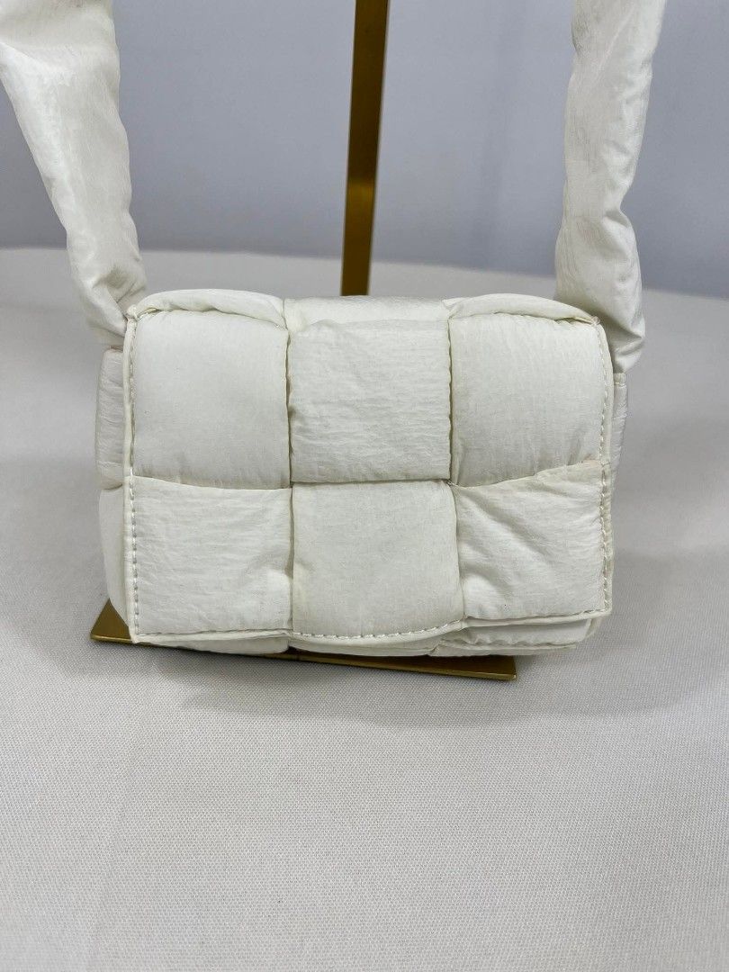 Bottega Veneta Mini Padded Cassette Bag (Category: Luxury Bags & Wallets) located in Mandaluyong City. Submitted by rossannela00032 (Listing ID 1437658785, Image 3). Description: - Bottega Veneta Mini Padded Cassette Bag - Color: Pristine White - Design: Padded with woven pattern - Features: Shoulder strap, flap closure - Includes: Originality certification tag.