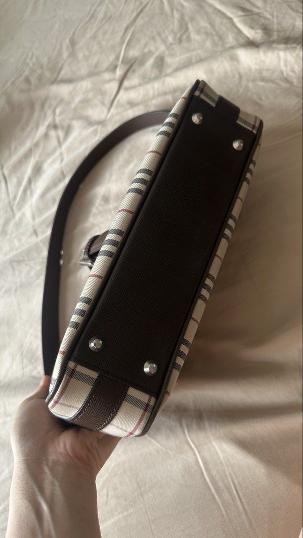 Burberry Checkered Shoulder kilikili Bag (Category: Luxury Bags & Wallets) located in Quezon City. Submitted by mema0522 (Listing ID 1437623679, Image 2). Description: - Authentic Burberry shoulder bag - Iconic checkered pattern - Brown leather strap and trim - Silver buckle closure - Zippered main compartment - Magnetic snap closure - Lined interior - Protective metal feet -bought personally from japan.