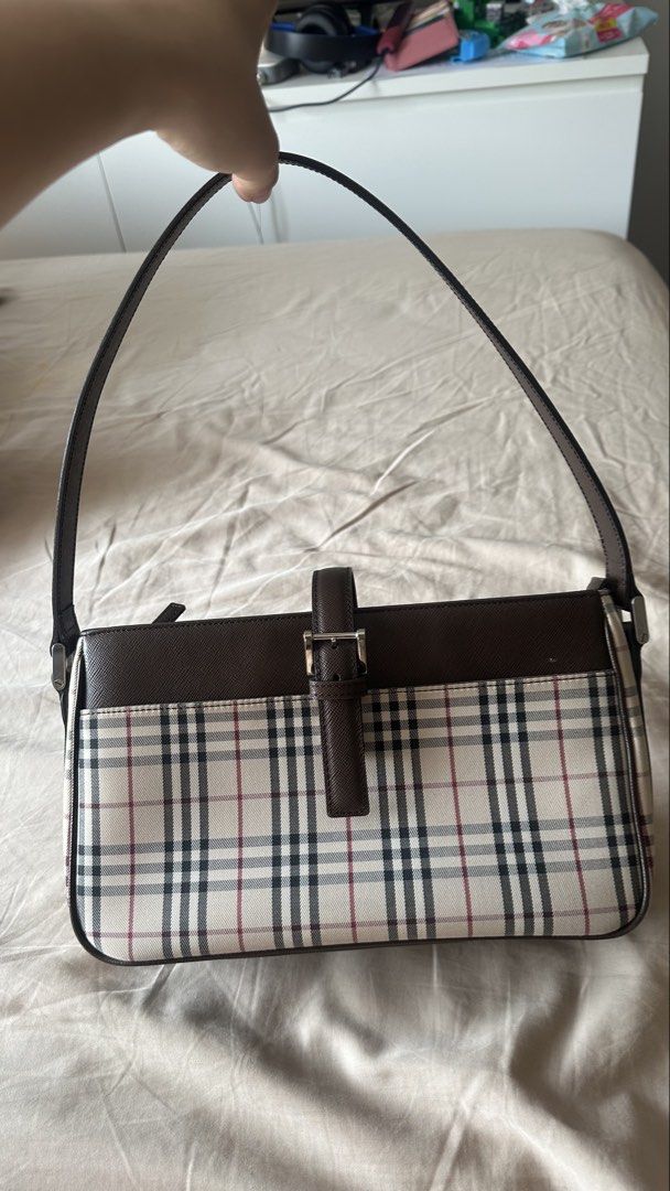 Burberry Checkered Shoulder kilikili Bag (Category: Luxury Bags & Wallets) located in Quezon City. Submitted by mema0522 (Listing ID 1437623679, Image 1). Description: - Authentic Burberry shoulder bag - Iconic checkered pattern - Brown leather strap and trim - Silver buckle closure - Zippered main compartment - Magnetic snap closure - Lined interior - Protective metal feet -bought personally from japan.
