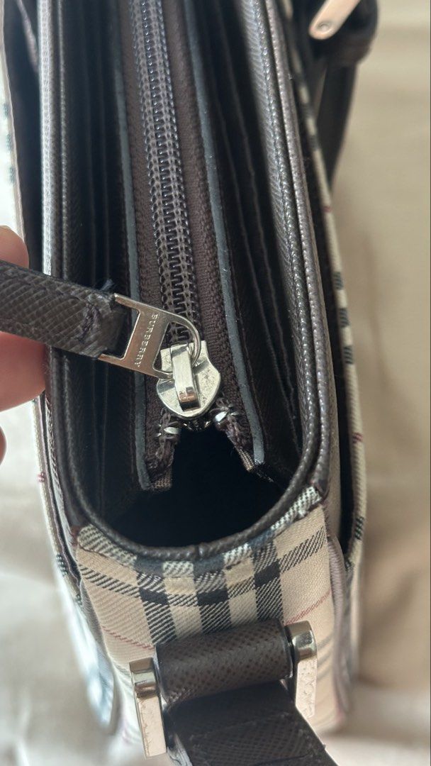 Burberry Checkered Shoulder kilikili Bag (Category: Luxury Bags & Wallets) located in Quezon City. Submitted by mema0522 (Listing ID 1437623679, Image 3). Description: - Authentic Burberry shoulder bag - Iconic checkered pattern - Brown leather strap and trim - Silver buckle closure - Zippered main compartment - Magnetic snap closure - Lined interior - Protective metal feet -bought personally from japan.