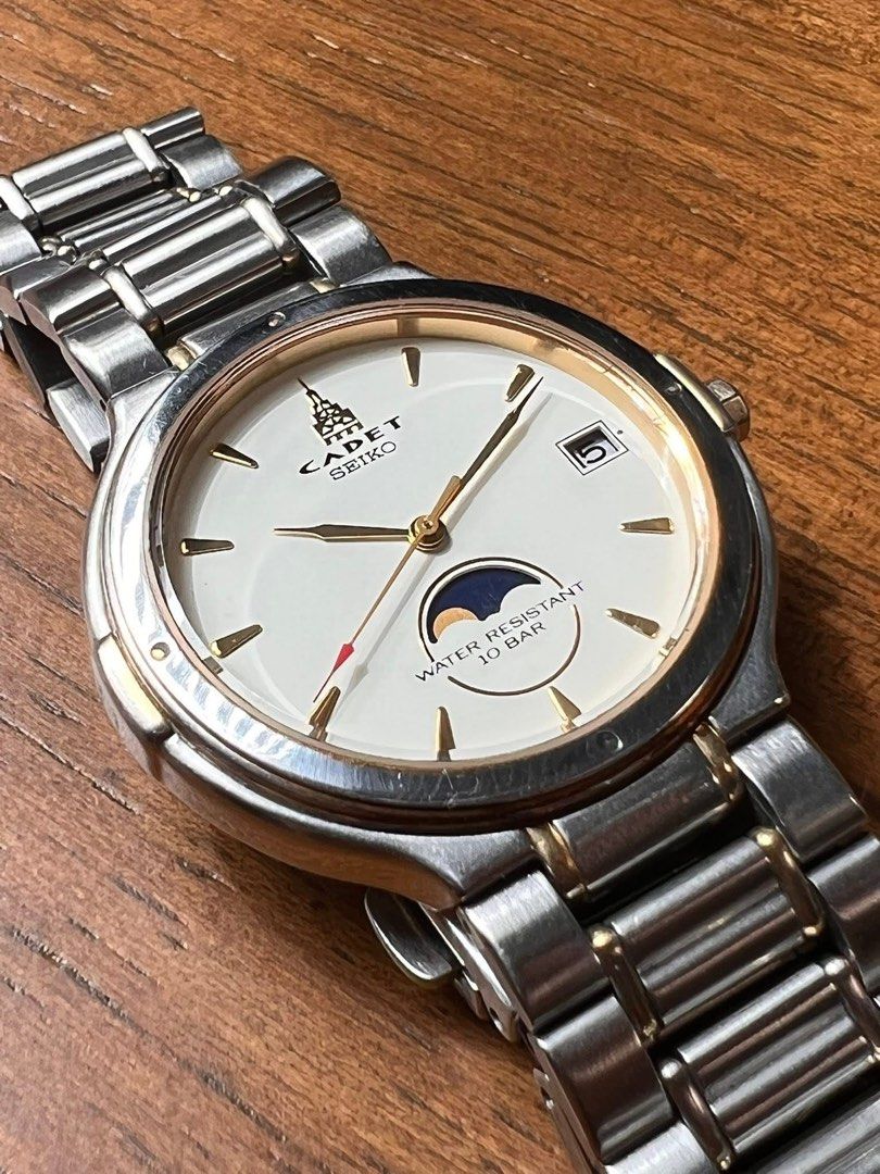 Cadet Seiko Moon Phase Watch (Category: Luxury Watches) located in Makati City. Submitted by mheegan_yadao (Listing ID 1437693552, Image 3). Description: 1999 September Seiko CADET Quartz – Classic 2-Tone Dress Watch 🔹 Moonphase-style subdial at 6 o’clock 🔹 10 BAR water resistant 🔹 Two-tone case with stainless steel bracelet 🔹 Slim and comfortable on wrist 💯 All original 💸 Price: Php 4,499 Inclusion: 🕰️Watch with 🎁replacement box. 📍 Loca