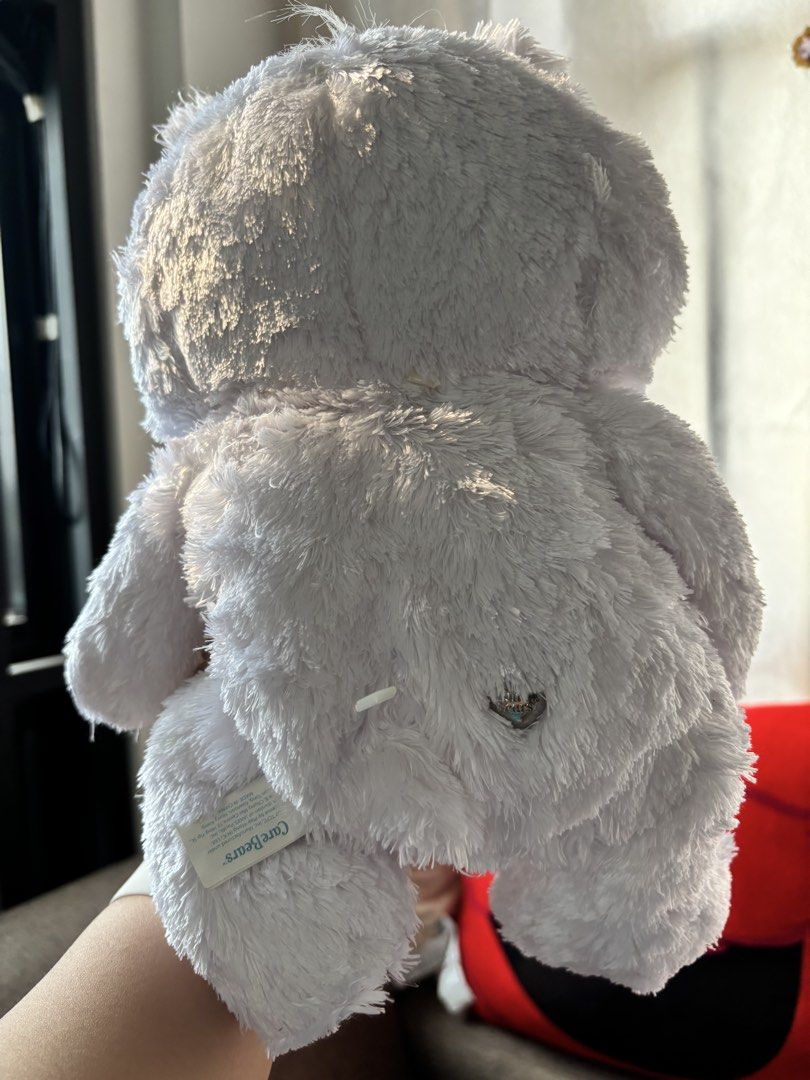 Care Bears 25th Anniversary Silver Bear Plush (Category: Plushies & Soft Toys) located in Mexico. Submitted by 3everything (Listing ID 1437640108, Image 2). Description: - Care Bears 25th Anniversary Edition - White, fluffy plush bear - Features a silver heart on chest and nose - "25 Years" embroidered on foot - Includes original Care Bears tag - Swarovski Crystal Eyes.