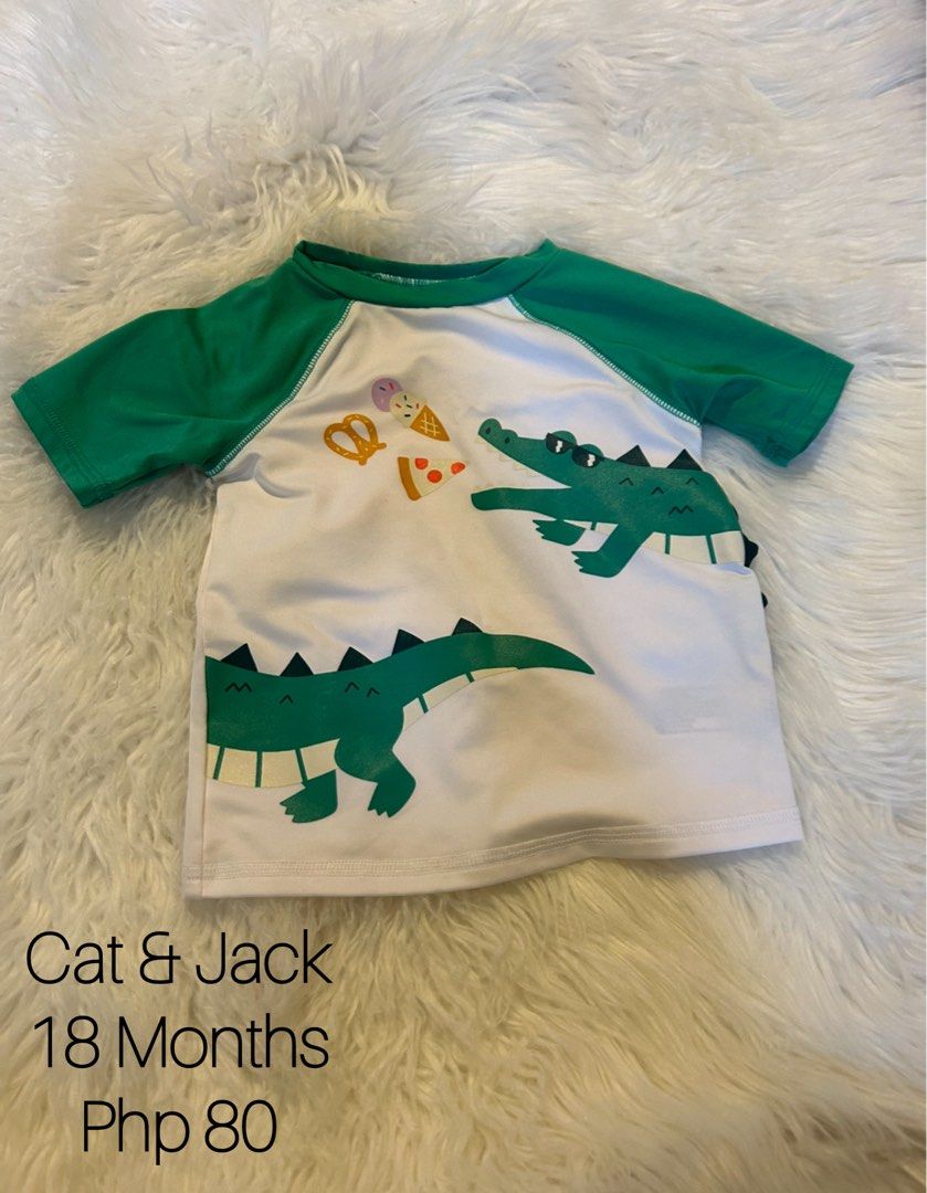 Cat & Jack Alligator Shirt 18 Months (Category: Babies & Kids Fashion) located in Mabalacat. Submitted by pamroxas16 (Listing ID 1437581986, Image 1). Description: - Cat & Jack shirt - Features an alligator design - Size: 18 months - Color: White body, green sleeves - Condition: Good.
