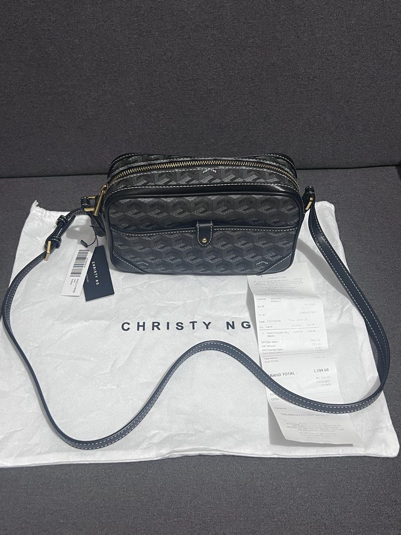 Christy Ng Crossbody Bag (Category: Cross-body Bags) located in Manila. Submitted by chasty91 (Listing ID 1437606337, Image 1). Description: - Christy Ng crossbody bag - Geometric pattern - Adjustable long strap - Double-zippered main compartment - Includes dust bag and tag - Clean interior - Stylish and practical.