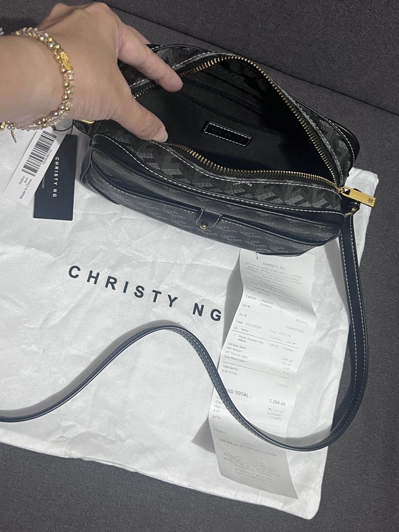 Christy Ng Crossbody Bag (Category: Cross-body Bags) located in Manila. Submitted by chasty91 (Listing ID 1437606337, Image 2). Description: - Christy Ng crossbody bag - Geometric pattern - Adjustable long strap - Double-zippered main compartment - Includes dust bag and tag - Clean interior - Stylish and practical.