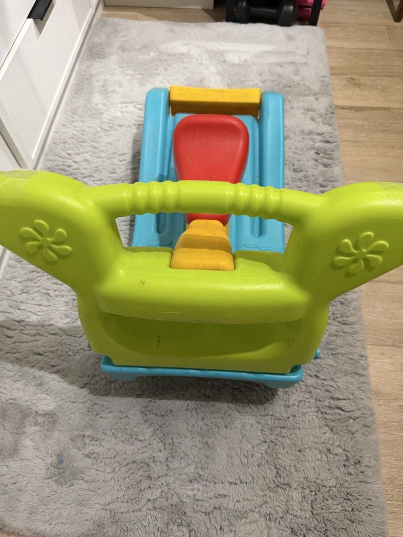Colorful Rocking Horse (Category: Infant Playtime) located in Paranaque City. Submitted by kyvn19 (Listing ID 1437721742, Image 2). Description: - Toddler-friendly rockingchair and slide - Bright colors: blue base, yellow seat, red seat, green handle - Designed with a sturdy base for safe rocking - Fun and engaging toy for young children.